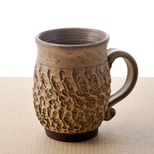 Mug with heavy texture handcrafted by Jane Mackay
